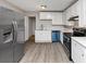 Bright kitchen with stainless steel appliances, white cabinets, and modern countertops, ready for cooking at 4275 Ridgetop Dr, Ellenwood, GA 30294