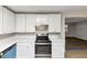 Kitchen with stainless steel oven, white cabinets, and light countertops at 4275 Ridgetop Dr, Ellenwood, GA 30294