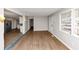 Inviting living room featuring hardwood floors, new paint, and an open view into the kitchen at 4275 Ridgetop Dr, Ellenwood, GA 30294