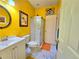 Cheerful bathroom showcasing tiled floors, a vanity with a modern sink, and a glass-enclosed shower at 1349 Orchard Park Dr, Stone Mountain, GA 30083