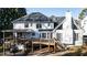 Backyard featuring a deck, mature trees, a golf cart, and ample space for outdoor enjoyment at 1701 Crowes Lake Ct, Lawrenceville, GA 30043