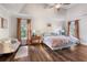 Comfortable main bedroom with beautiful hardwood floors, a decorative headboard, and lots of natural light at 1701 Crowes Lake Ct, Lawrenceville, GA 30043