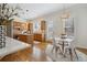 Open kitchen and breakfast nook featuring wood floors, wood cabinets, and a view of the neighborhood at 2317 Saint Davids Nw Sq, Kennesaw, GA 30152