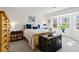 Bright bedroom features a bay window, wood furniture, and neutral walls at 6038 Maryjo Ln, Norcross, GA 30093