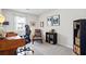 Bright home office featuring a wood desk, neutral walls, and gray carpet at 6038 Maryjo Ln, Norcross, GA 30093