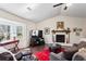 Cozy living room featuring a fireplace, hardwood floors, and a bay window for natural light at 6038 Maryjo Ln, Norcross, GA 30093