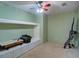 Cozy bedroom featuring custom built-ins with storage and unique wall decor at 6935 Autumn Hills Dr, Cumming, GA 30028
