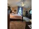 Cozy bedroom with vaulted ceilings, large window, and a comfortable queen-sized bed at 6935 Autumn Hills Dr, Cumming, GA 30028