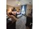 Comfortable bedroom featuring vaulted ceilings, natural light, and a cozy atmosphere at 6935 Autumn Hills Dr, Cumming, GA 30028