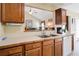 Kitchen features include wood cabinets, updated countertops, and natural light at 6935 Autumn Hills Dr, Cumming, GA 30028