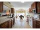 Kitchen featuring a window with space for dining, tile flooring, and plenty of cabinets at 6935 Autumn Hills Dr, Cumming, GA 30028