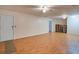 Living room with laminate flooring and a utility closet at 6935 Autumn Hills Dr, Cumming, GA 30028