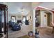 Spacious living room features a fireplace, ample seating, and neutral decor at 6935 Autumn Hills Dr, Cumming, GA 30028