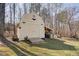 The backyard includes a barn-shaped shed, ready to store all your extra belongings at 6935 Autumn Hills Dr, Cumming, GA 30028