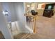 Carpeted staircase leading to an open floor plan with a view to a relaxing living space at 6935 Autumn Hills Dr, Cumming, GA 30028