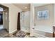 Well-lit bathroom with a shower and soaking tub, creating a calming and spa-like atmosphere for relaxation at 316 Silverwood Dr, Dallas, GA 30157