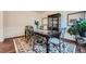 Bright dining room with hardwood floors, a large table, and elegant decor, perfect for entertaining at 316 Silverwood Dr, Dallas, GA 30157