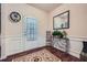 Bright foyer featuring hardwood floors, fresh paint, classic trim, and decorative accents at 316 Silverwood Dr, Dallas, GA 30157