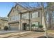 Beautiful two-story home featuring stone accents, manicured landscaping, and an attached two-car garage at 316 Silverwood Dr, Dallas, GA 30157