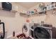 Well-organized laundry room with modern washer and dryer and ample storage space at 316 Silverwood Dr, Dallas, GA 30157