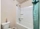 Shower/tub combo featuring white tiling and a green shower curtain at 316 Silverwood Dr, Dallas, GA 30157