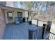 Spacious back deck perfect for relaxing, with wood flooring, outdoor seating and barbeque at 3970 Brenteresa Ct, Snellville, GA 30039