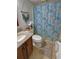 Bathroom with a shower/tub combination, decorative shower curtain, and vanity at 3970 Brenteresa Ct, Snellville, GA 30039