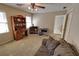 Comfortable bedroom with carpet, study space and a ceiling fan fixture at 3970 Brenteresa Ct, Snellville, GA 30039