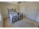 Comfortable bedroom with a bed, fan, and plenty of natural light at 3970 Brenteresa Ct, Snellville, GA 30039
