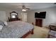 Bright bedroom with a large bed, dresser, and TV for relaxing and entertaining at 3970 Brenteresa Ct, Snellville, GA 30039