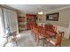 Formal dining room featuring a large wood table and china cabinet at 3970 Brenteresa Ct, Snellville, GA 30039