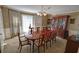 Formal dining room featuring a large wood table and china cabinet at 3970 Brenteresa Ct, Snellville, GA 30039