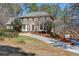 Charming two-story brick home featuring a long driveway and a detached garage at 3970 Brenteresa Ct, Snellville, GA 30039
