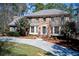 Elegant brick home with a well-manicured lawn, bay windows, and a welcoming front entrance at 3970 Brenteresa Ct, Snellville, GA 30039