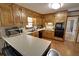 This is a kitchen with wooden cabinets, a microwave, oven and a black dishwasher at 3970 Brenteresa Ct, Snellville, GA 30039