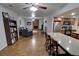 Open-concept living room flowing into the kitchen, with a fireplace and breakfast bar at 3970 Brenteresa Ct, Snellville, GA 30039