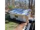 Charming outbuilding with a metal roof, offering versatile space for a workshop or studio at 3970 Brenteresa Ct, Snellville, GA 30039