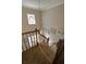 Staircase featuring carpeted steps, wooden railing and a decorative window at 3970 Brenteresa Ct, Snellville, GA 30039