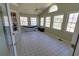 Sunroom with many windows, tile flooring, hammock and plenty of natural light at 3970 Brenteresa Ct, Snellville, GA 30039