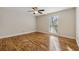 Bright, spacious bedroom with hardwood floors and a ceiling fan at 408 River Run Dr, Atlanta, GA 30350