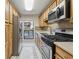 Galley kitchen featuring tile floors and stainless steel appliances at 408 River Run Dr, Atlanta, GA 30350