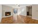 Bright living room featuring a fireplace, sliding glass doors, and hardwood flooring at 408 River Run Dr, Atlanta, GA 30350