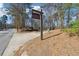 Allenbrook: Chattahoochee River National Recreation Area signage by a road near a wooded trail entrance at 408 River Run Dr, Atlanta, GA 30350