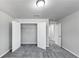 Bright, carpeted bedroom with closet and neutral walls, creating a comfortable and inviting space at 7104 Skippingstone Way, Douglasville, GA 30134