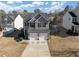 Charming home with a two-car garage and well-maintained landscaping at 7104 Skippingstone Way, Douglasville, GA 30134