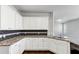 Spacious kitchen featuring granite countertops, white cabinets, stainless steel appliances at 7104 Skippingstone Way, Douglasville, GA 30134