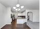 Open kitchen with stainless appliances and a granite countertop island at 7104 Skippingstone Way, Douglasville, GA 30134