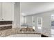 Modern kitchen featuring granite countertops and stainless steel sink at 7104 Skippingstone Way, Douglasville, GA 30134