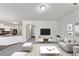 Cozy living room furnished with neutral-toned sofa and entertainment center at 7104 Skippingstone Way, Douglasville, GA 30134