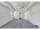 Large main bedroom with plush carpet, tray ceiling and an ensuite bathroom at 7104 Skippingstone Way, Douglasville, GA 30134